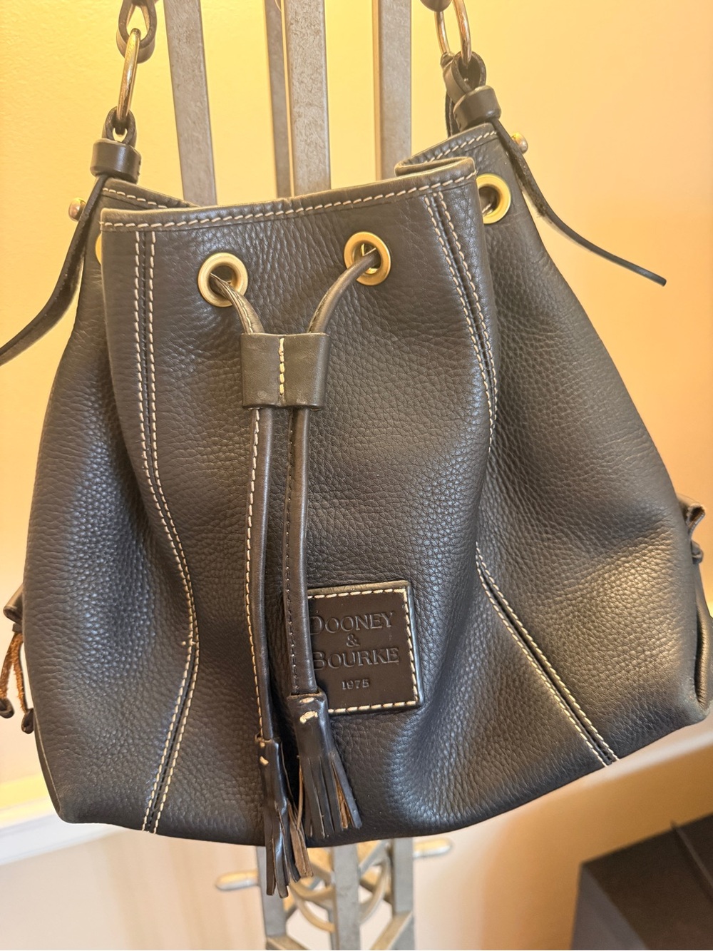 Dooney & Bourke Black Pebbled Leather Drawstring Bucket Bag with Gold Hardware
